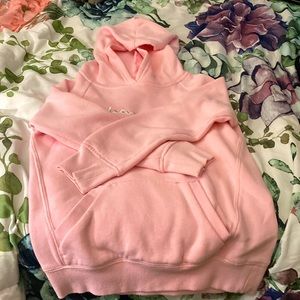 Pink champions sweater with a hood